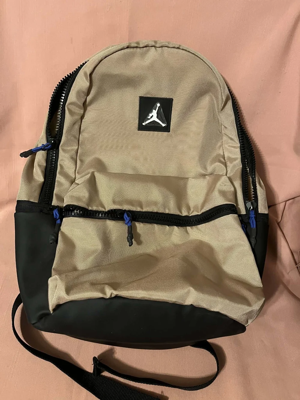 Jordan Two-Tone Tan and Black Backpack with Blue Accents